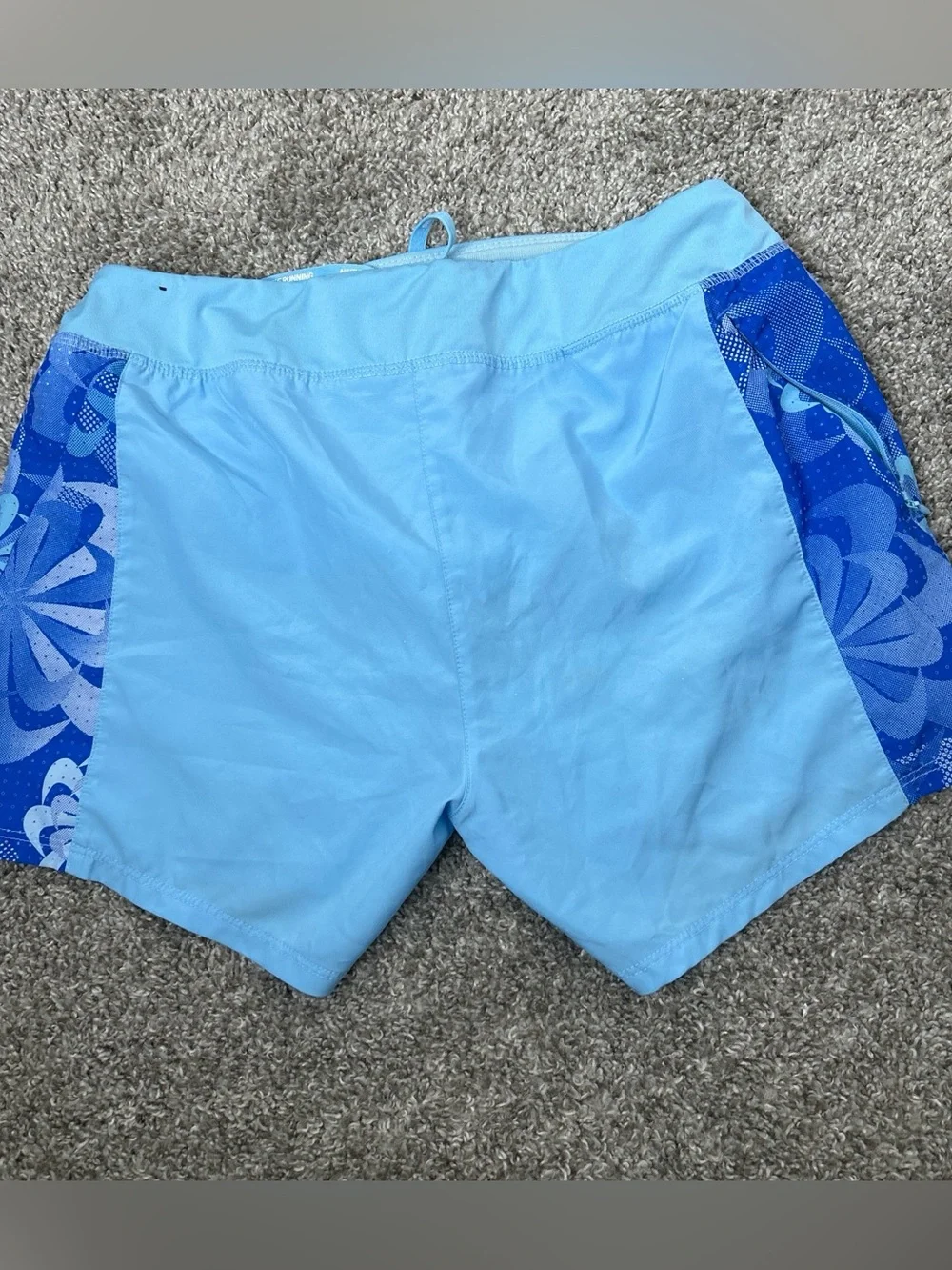 Nike girl’s Light Blue Athletic Shorts with Dark Blue Floral Panels